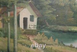 Grand tableau ancien à l'huile paysage de rivière, forêt et maison