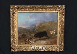 Grand tableau antique à l'huile du 19e siècle représentant un combat entre un taureau et un loup dans un paysage montagneux