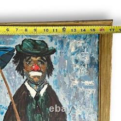 Peinture à l'huile antique d'un triste clown sous la pluie tenant un parapluie signée Grifoll Espagne